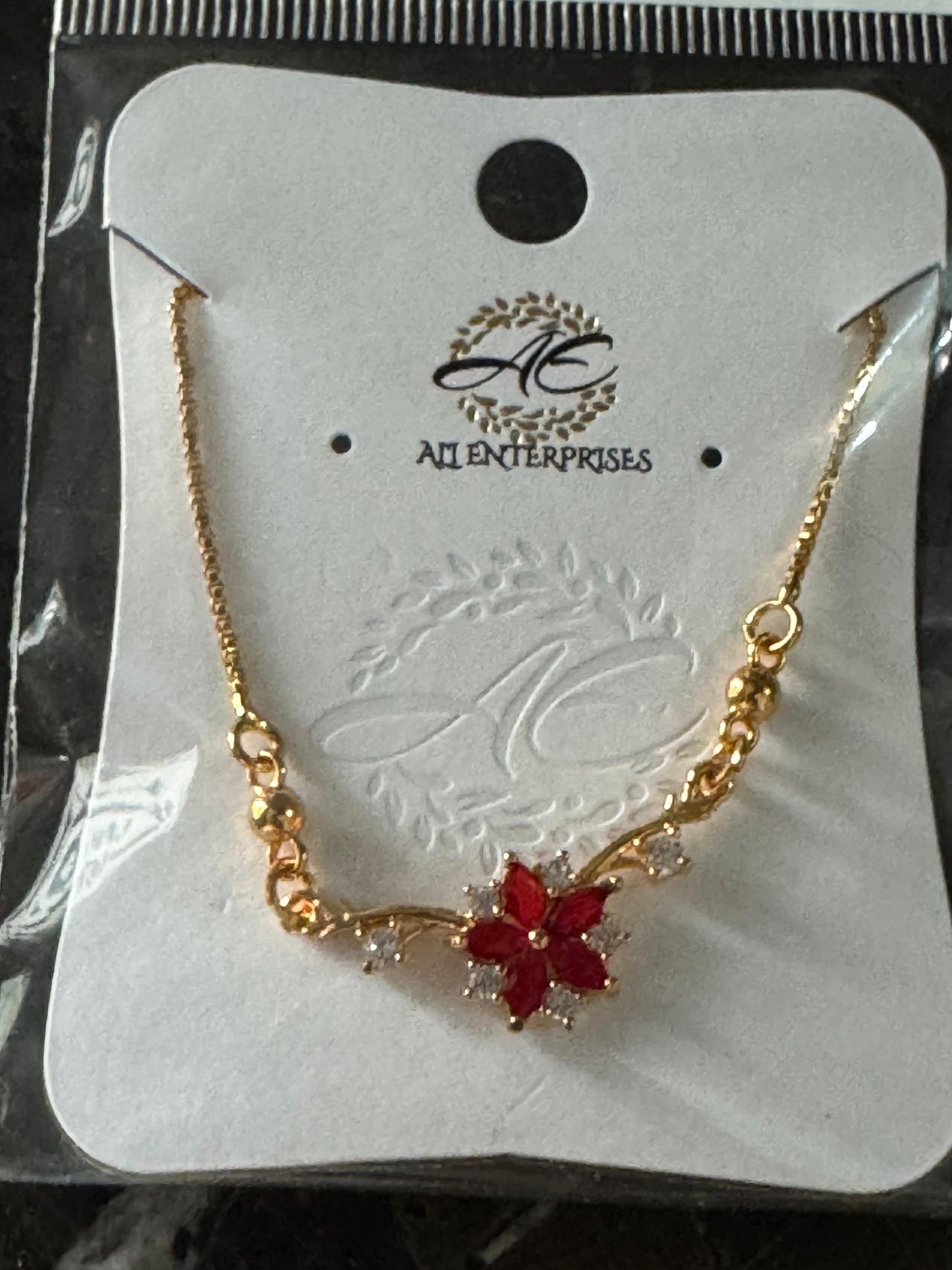 Red Floral Charm Bracelet with Crystal Accents – AI Enterprises