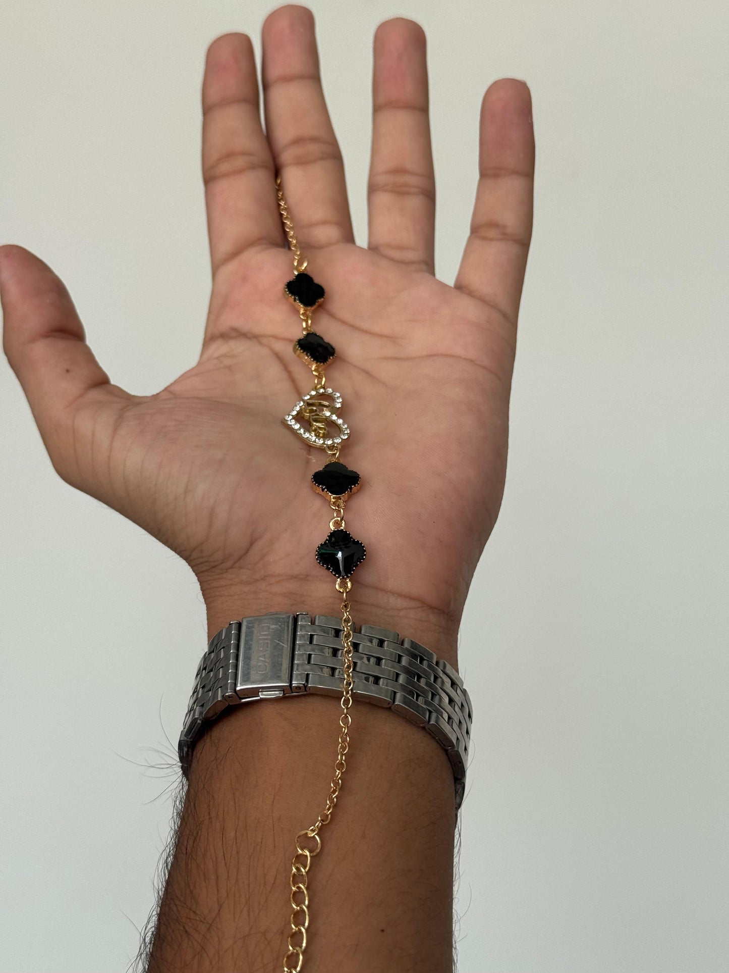 Black Clover Charm Bracelet with Gold Chain & Crystal Accent – Elegant Wristwear